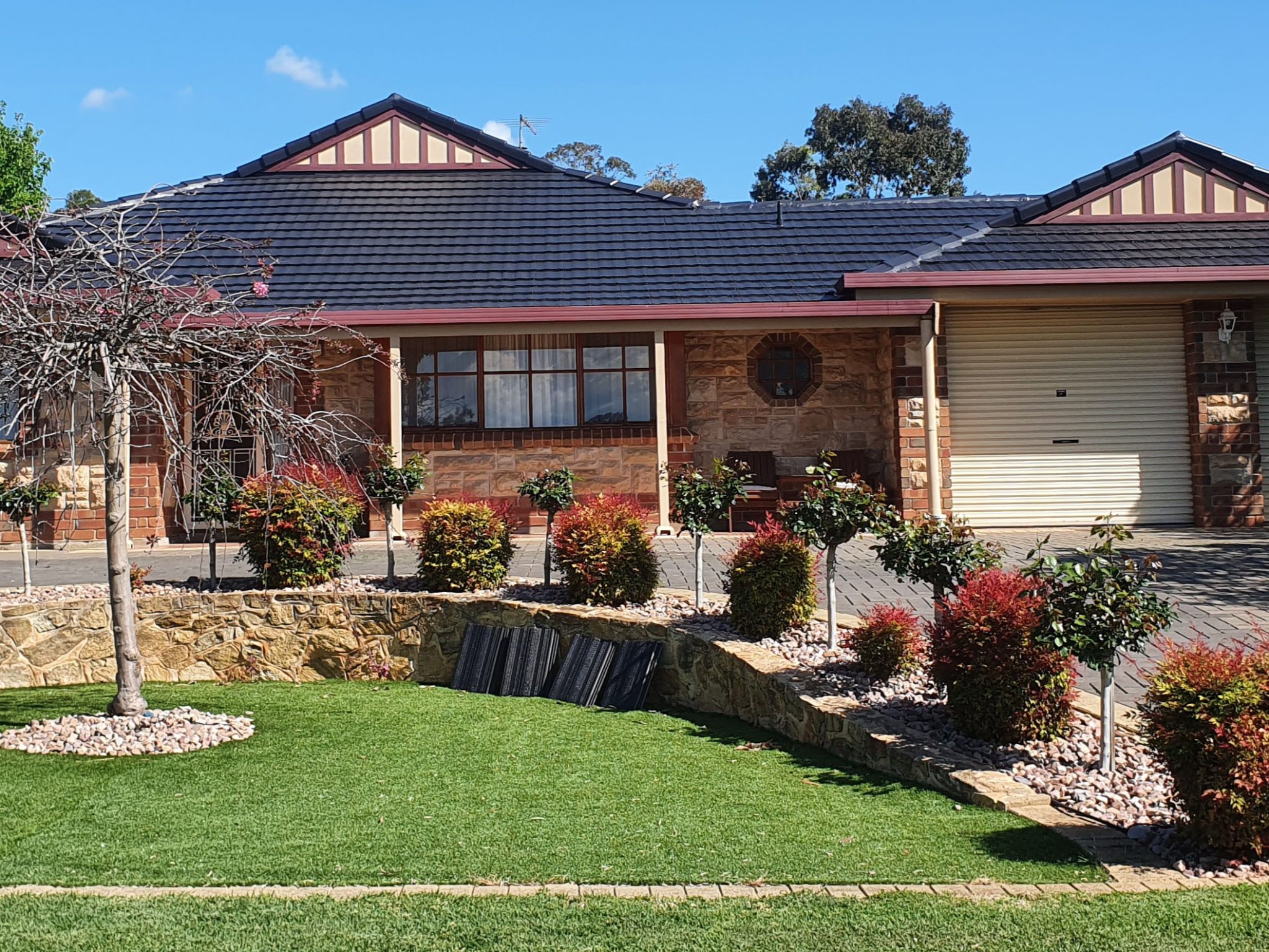 Roof on a home with a landscaped front garden